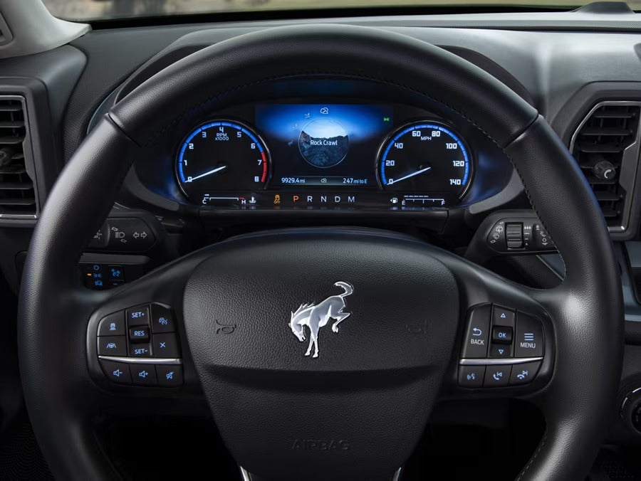 the heads up display and steering wheel of an suv