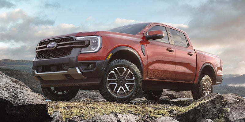 A red truck sitting parked outside.