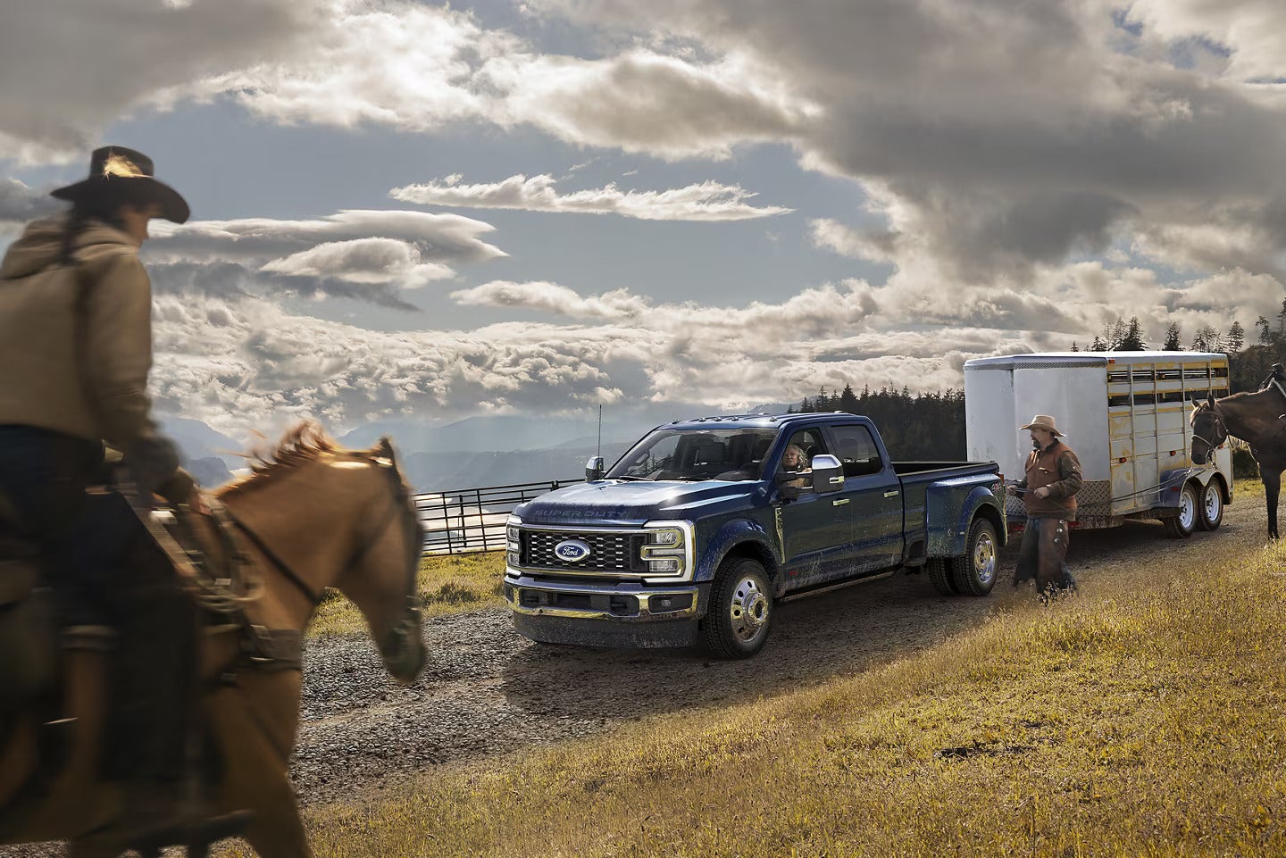 a ford super duty truck at a horse ranch hauling a stock trailer