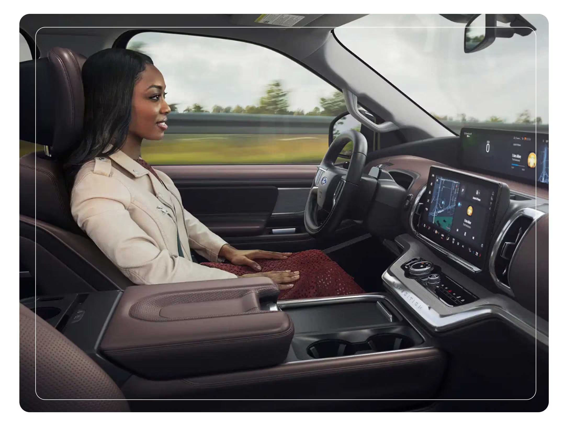 Woman in the driver’s seat of a Ford Expedition enjoying the hands-free driving experience.