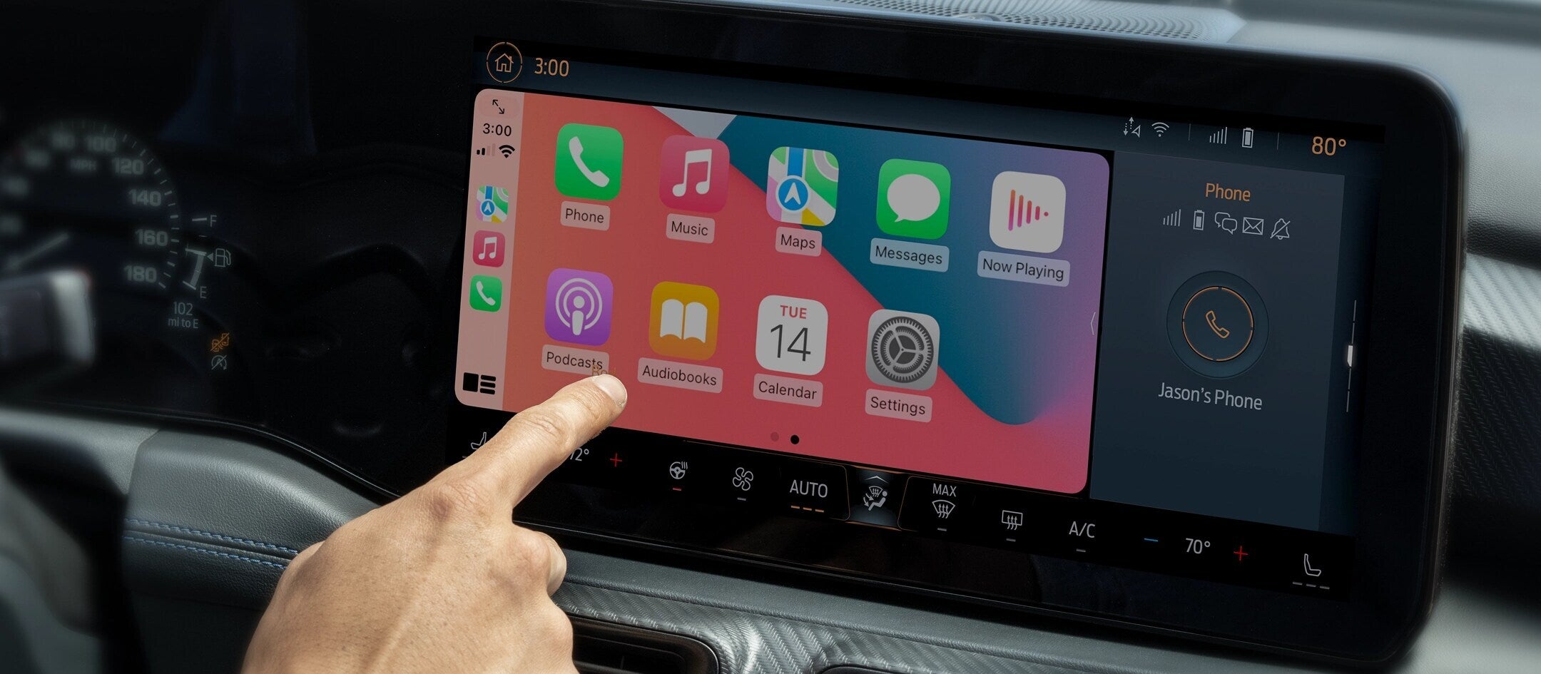 Close-up of a person interacting with the Apple CarPlay interface on the 2025 Ford Mustang's infotainment screen.