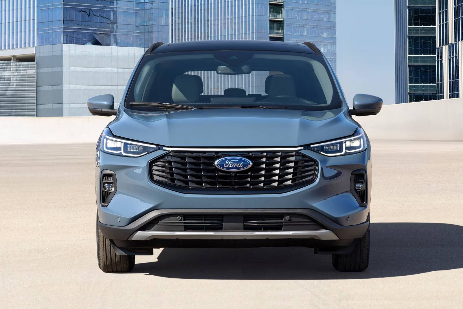 A blue suv sitting parked.